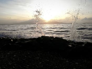 Scenic view of sea against sky at sunset