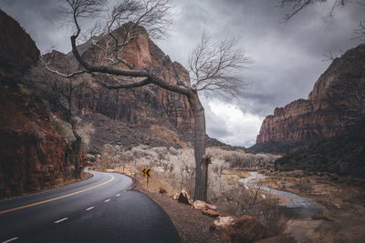 A road between mountains in zion national park, utah