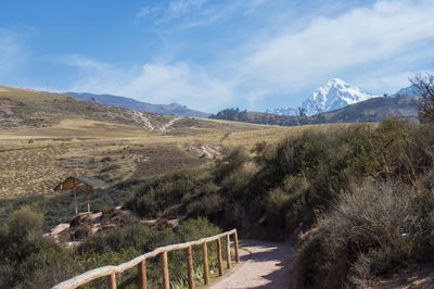 Scenic view of mountains against cloudy sky