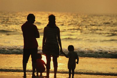 Silhouette of people at sunset