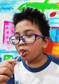 Close-up portrait of young man with eyeglasses