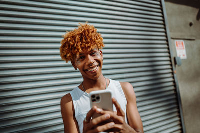 Young woman using mobile phone
