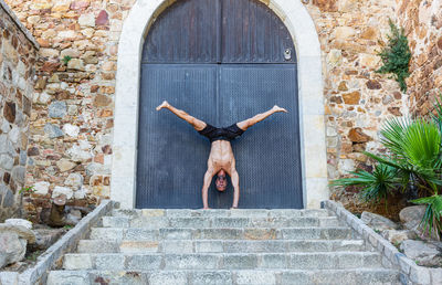 Sportsman practicing stretching and calisthenics