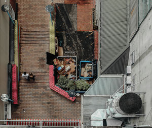 Directly above shot of people walking on steps by building