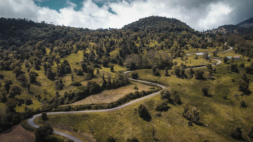 High angle view of trees and mountains against sky