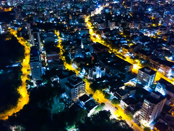 High angle view of illuminated buildings in city at night