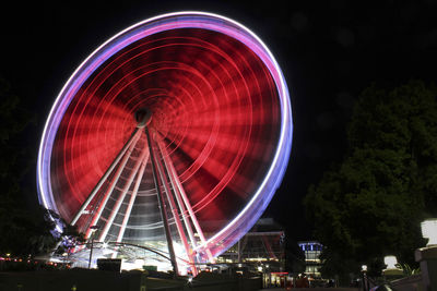 Illuminated spinning wheel of brisbane at night