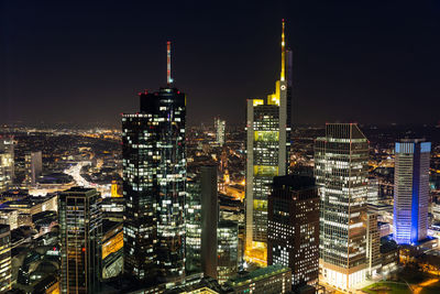 Illuminated buildings in city at night