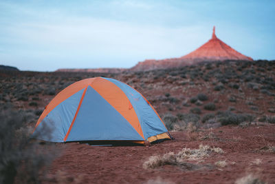 Tent on field against sky