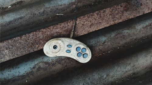 High angle view of rusty metal on wall