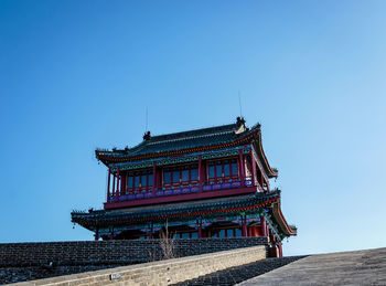 Low angle view of building against blue sky