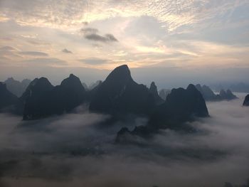 Scenic view of mountains against sky during sunset