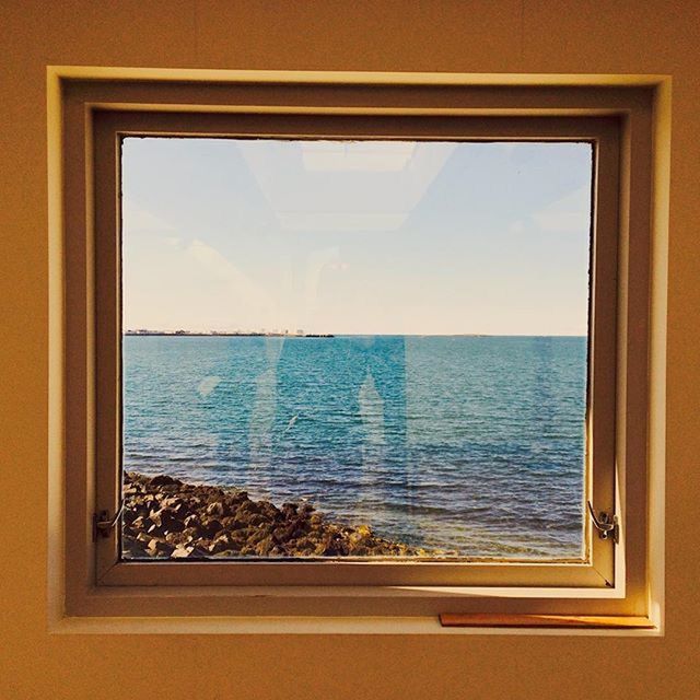 VIEW OF SEA THROUGH WINDOW