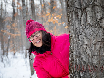 Portrait of a smiling young woman in winter