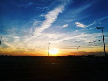 Silhouette landscape against sky during sunset