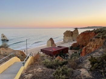 Scenic view of sea against clear sky during sunset
