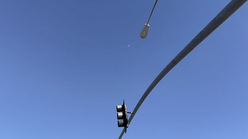 Low angle view of street light against clear blue sky