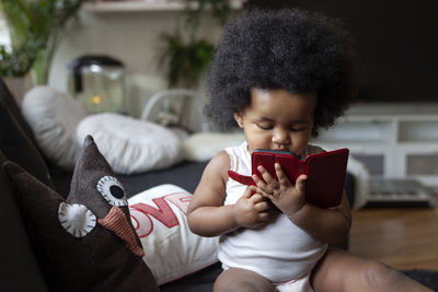 Toddler girl using cell phone