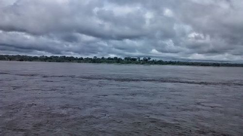 Scenic view of landscape against cloudy sky