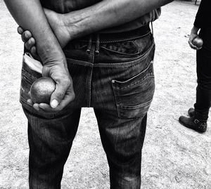 Cropped image of man holding hands