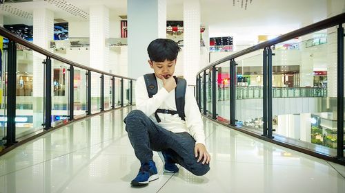 Man sitting in shopping mall