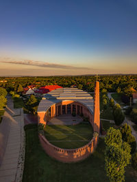 High angle view of buildings against blue sky