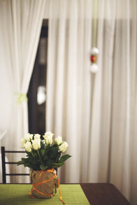 Close-up of vase on table at home