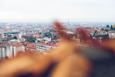 High angle view of city buildings against sky