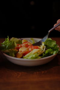 Close-up of salad and fork on table