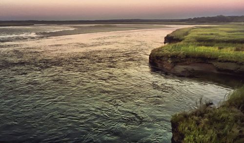 Scenic view of beach against sky