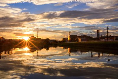 Scenic view of buildings against sky during sunset