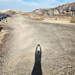 Shadow of man on rock