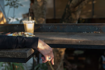 Midsection of person relaxing by temple