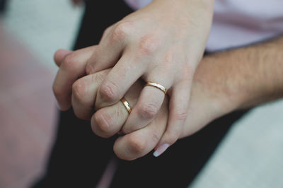 Close-up of couple holding hands