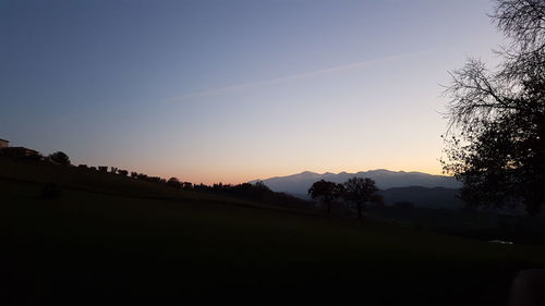 Scenic view of silhouette mountains against clear sky