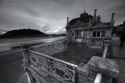 Old building against sky at dusk