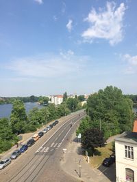 High angle view of road by trees against sky