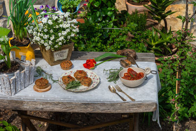 High angle view of potted plants on table at yard