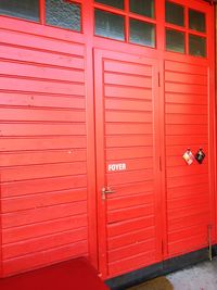 Closed door of red wall