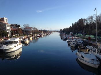 Boats in canal at harbor