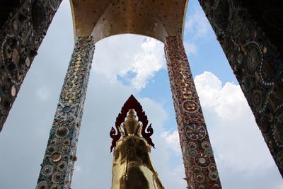 Low angle view of statue against cloudy sky