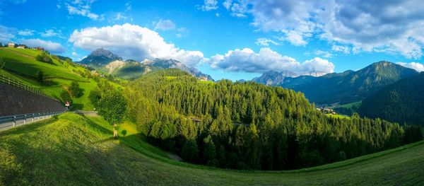 Scenic view of mountains against cloudy sky