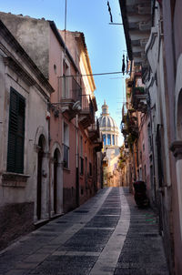 Narrow alley amidst buildings in city