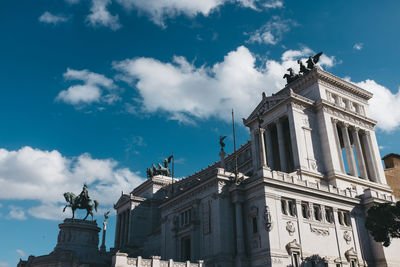 Low angle view of historical building against cloudy sky