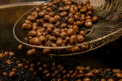 Close-up of chestnut roasting in container