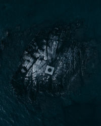 Drone view of rock formation in sea