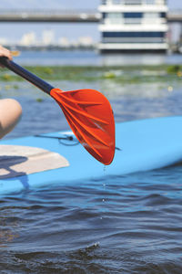 Person holding umbrella in sea