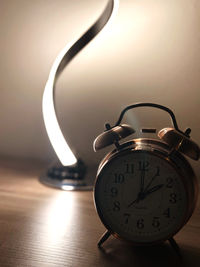 Close-up of clock on table