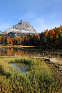 Scenic view of lake against sky during autumn