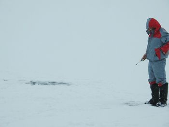 Woman standing in snow